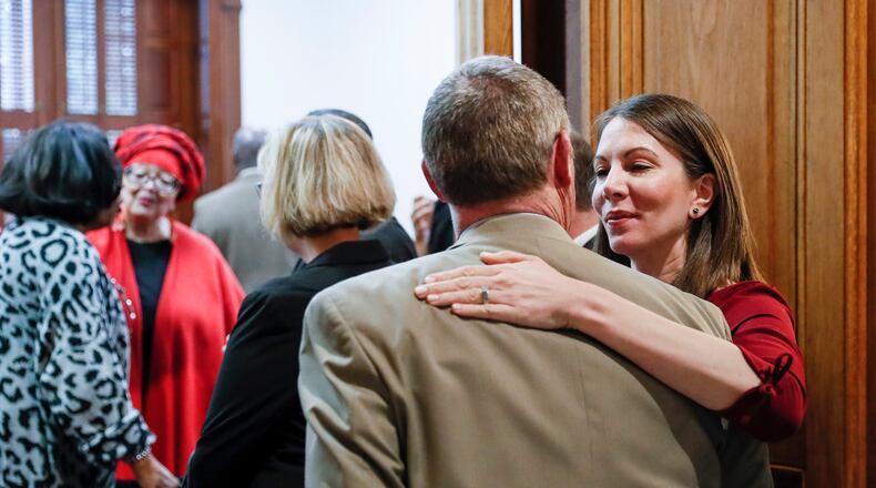 March 2, 2020 - Atlanta - Former state representative and candidate for governor Stacey Evans greets Democratic colleagues in line for qualifying.  She is running for representative in district 57.  A large turnout by both Democrats and Republicans on the first day of election qualifying resulted in long lines of politicians waiting to sign in.   Bob Andres / robert.andres@ajc.com