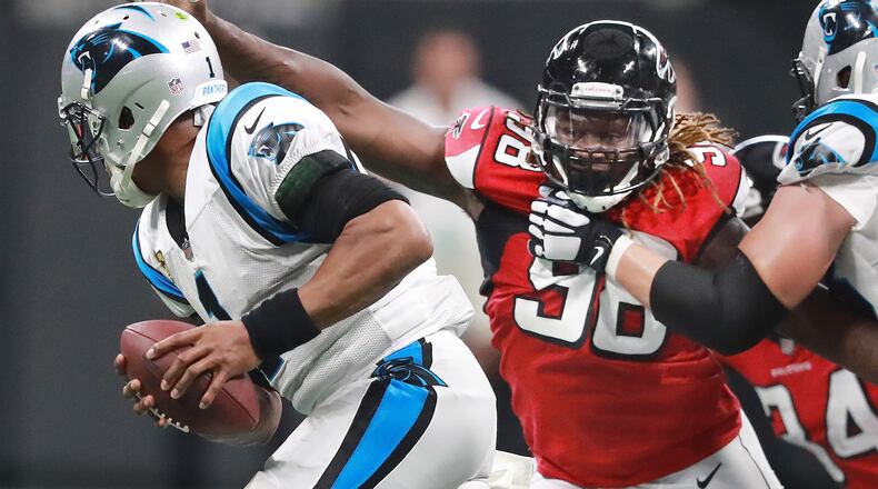 Falcons defensive end Takk McKinley flushes Carolina quarterback Cam Newton out of the pocket. (Curtis Compton/ccompton@ajc.com)