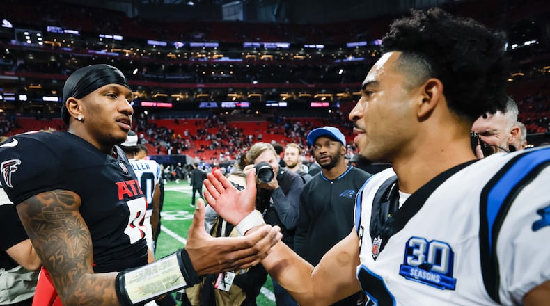 Atlanta Falcons quarterback Michael Penix Jr. (9) greets Carolina Panthers quarterback Bryce Young (9) at the end of the game on Sunday, January 5, 2025, at Mercedes-Benz Stadium in Atlanta. Falcons lost in overtime 44-38.
(Miguel Martinez/ AJC)
