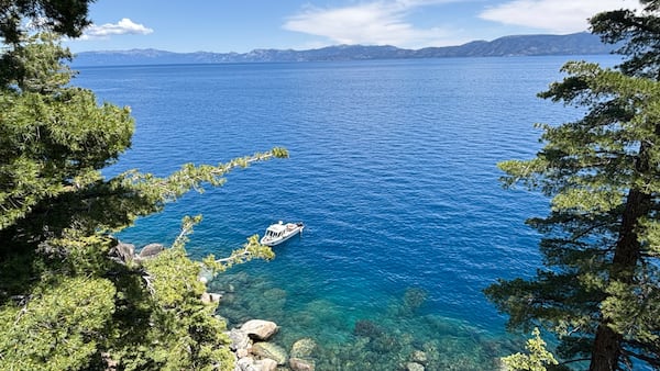 Authorities conduct searches along the shore at D.L. Bliss State Park after a weekend incident in which a boat capsized, killing several people, on Monday, June 23, 2025, in South Lake Tahoe, Calif. (AP Photo/Brooke Hess-Homeier)