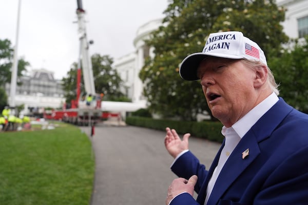 President Donald Trump speaks as a flag pole is installed on the South Lawn of the White House, Wednesday, June 18, 2025, in Washington. (AP Photo/Evan Vucci)