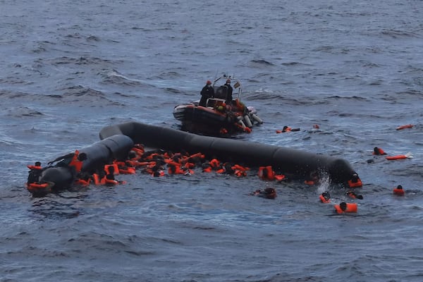 FILE - Refugees and migrants are rescued by members of the Spanish NGO Proactiva Open Arms in the Mediterranean Sea on Nov. 11, 2020. (AP Photo/Sergi Camara, File)