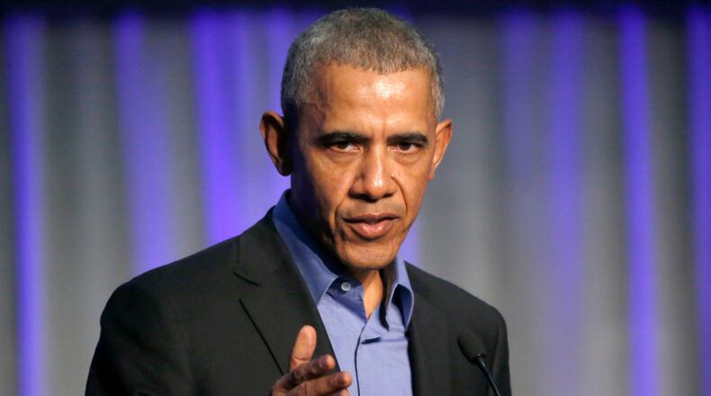 Former President Barack Obama addresses the participants at a summit on climate change involving mayors from around the globe Tuesday, Dec. 5, 2017, in Chicago. The conference comes after President Trump said the U.S. will pull out of the Paris agreement. (AP Photo/Charles Rex Arbogast)