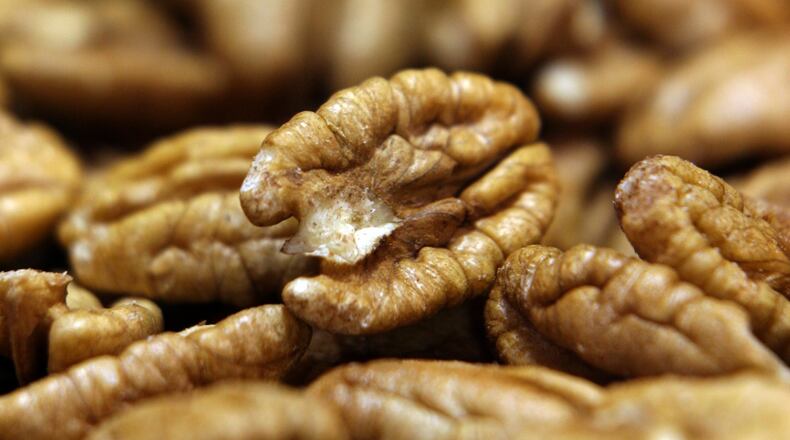 Shelled pecan halves dry at D & V Pecans in Byron. (Ben Gray/Staff)