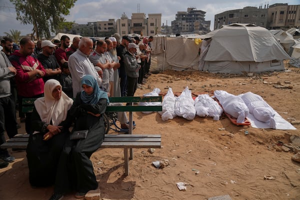 Relatives mourn over the bodies of several members of the Abu Mahdi family, killed in an Israeli army airstrike, during their funeral at the Indonesian hospital in Beit Lahia, northern Gaza Strip, Monday, April 28, 2025. (AP Photo/(AP Photo/Jehad Alshrafi)