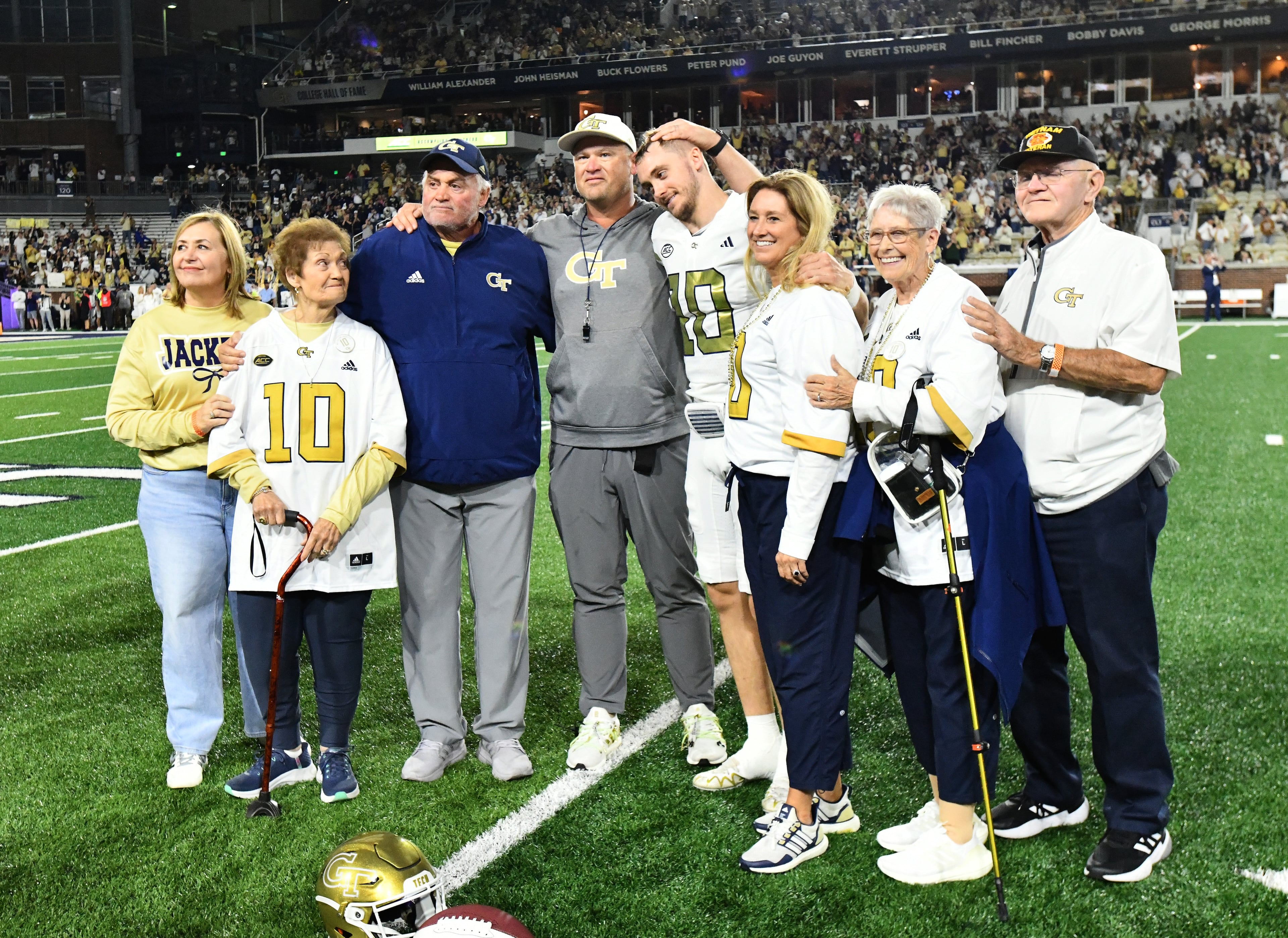 Georgia Tech head coach Brent Key poses with quarterback Haynes King and his family during a senior night event prior to the final regular-season home game against Pittsburgh at Bobby Dodd Stadium, Saturday, November 22, 2025 in Atlanta. (Hyosub Shin / AJC)
