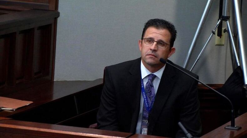 Cobb County Det. Edward Stockinger testifies Friday at the hot-car murder trial. Stockinger was the one who officially told Leanna Harris her son was dead. (screen capture from WSB-TV) WSB-TV