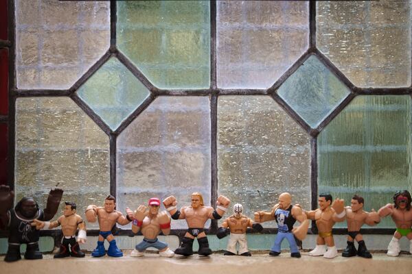 Wrestling figurines are seen backstage at St Peter's Church in Shipley before one of Kingdom Wrestling's monthly wrestling shows, Saturday, March 29, 2025. (AP Photo/Jon Super)