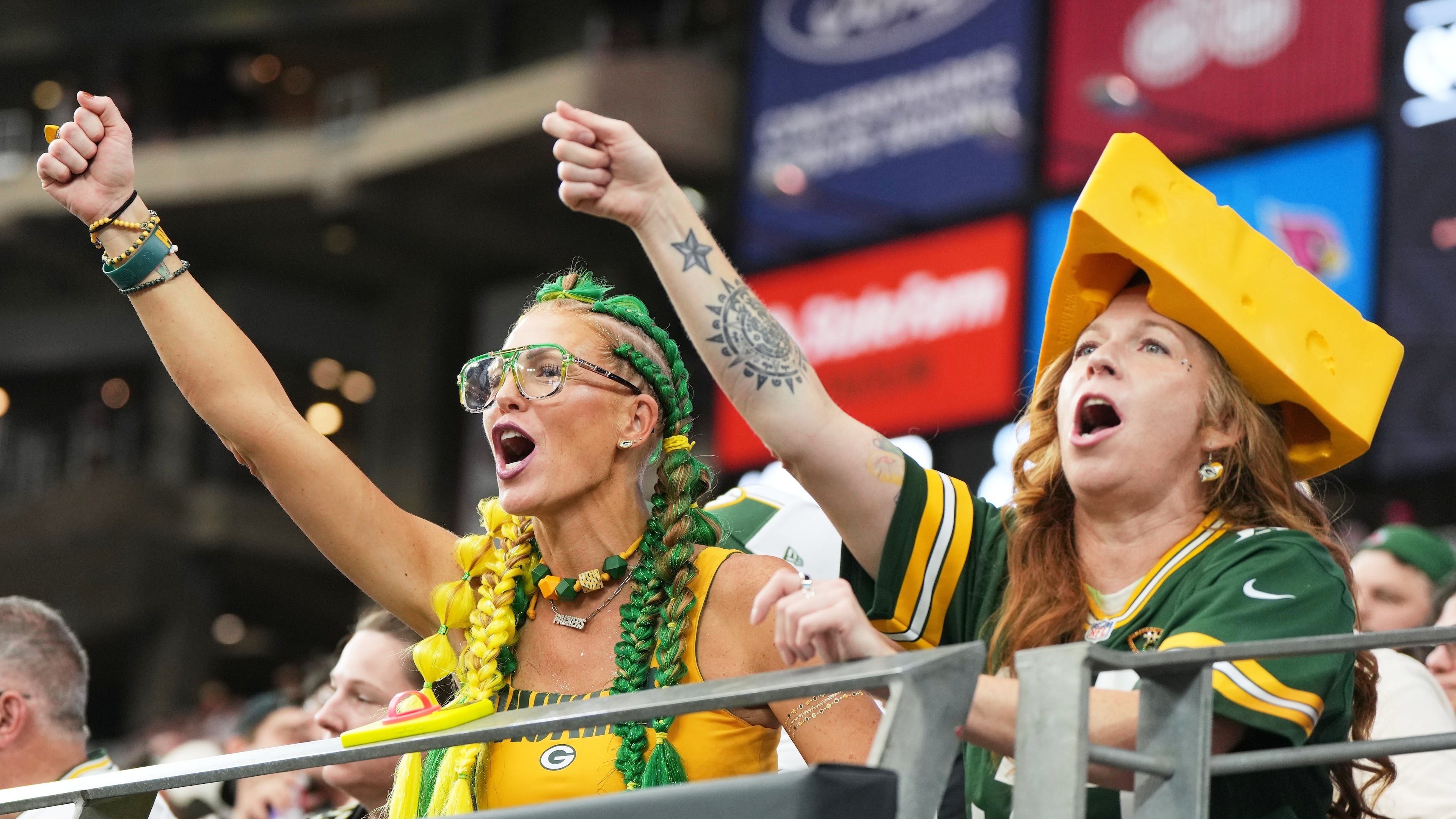 FILE - Green Bay Packers fans cheer during the first half of an NFL football game against the Arizona Cardinals Sunday, Oct. 19, 2025, in Glendale, Ariz. (AP Photo/Rick Scuteri, File)