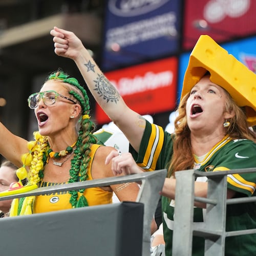 FILE - Green Bay Packers fans cheer during the first half of an NFL football game against the Arizona Cardinals Sunday, Oct. 19, 2025, in Glendale, Ariz. (AP Photo/Rick Scuteri, File)