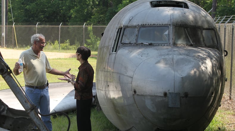 May 19, 2017, Toccoa, Georgia - Cynthia Brown (right) a Toccoa resident and institutional advancement director at North Georgia Technical College, speaks with Gary Bellamy (left), the President of the Camp Toccoa at Currahee Project about the undertaking involved in putting back together the Douglas C-47 they acquired from a man in Alabama in Toccoa, Georgia, on May 19, 2017. (HENRY TAYLOR / HENRY.TAYLOR@AJC.COM)