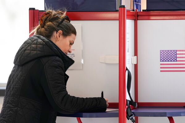 Josette Baublitz marks her ballot while voting at Waters Edge event venue in the state's Supreme Court election, Tuesday, April 1, 2025, in Milwaukee. (AP Photo/Kayla Wolf)