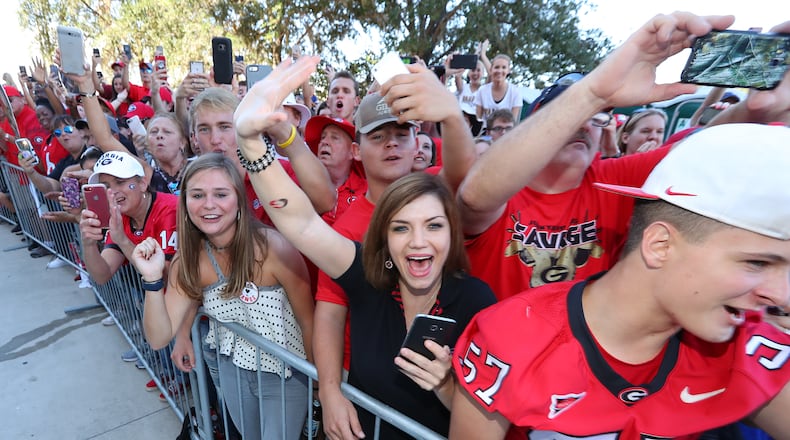 October 28, 2017 Jacksonville: Fans cheers their team as Georgia arrives at EverBank Field during the Dawg Walk for the Georgia-Florida game on Friday, October 27, 2017, in Jacksonville. Curtis Compton/ccompton@ajc.com