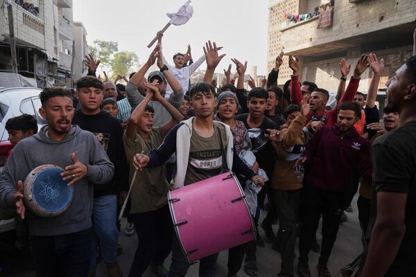 FILE - Palestinians chant slogans during a protest against the war and Hamas in Beit Lahiya, northern Gaza Strip, Wednesday, March 26, 2025, in a rare show of public anger against the militant group that rules the territory. (AP Photo/Jehad Alshrafi, File)