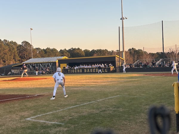 Harris County sophomore Will Dimitri, nephew of the team's late coach, Tony Dimitri, scored the team's first run of the season. He scored from third base next to the coach's box, which was left empty in the first inning to honor Tony Dimitri. (Jack Leo/AJC)
