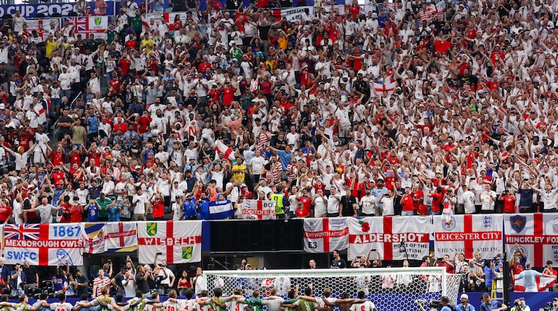 Fans stand and cheer for England after the team defeated Congo 2-1 during a World Cup match in the round of 32 at Atlanta Stadium on Wednesday, July 1, 2026, in Atlanta. (Jason Getz/AJC)
