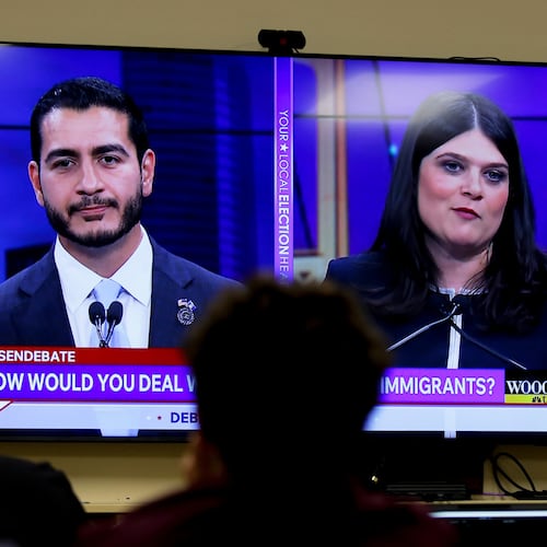Michigan U.S. Senate candidates, Abdul El-Sayed, left, and Rep. Haley Stevens, D-Mich., are displayed on a television during a debate inside the spin room at WoodTV studios on Tuesday, July 7, 2026, in Grand Rapids, Mich. (AP Photo/Kristen Norman)