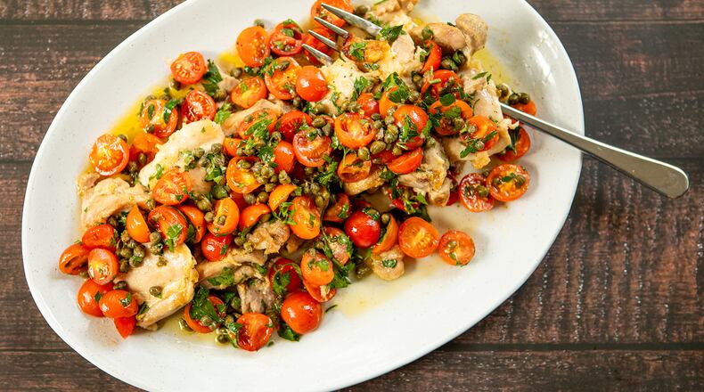 Chicken Thighs with Puttanesca Sauce. (Aaliyah Man for The Atlanta Journal-Constitution)