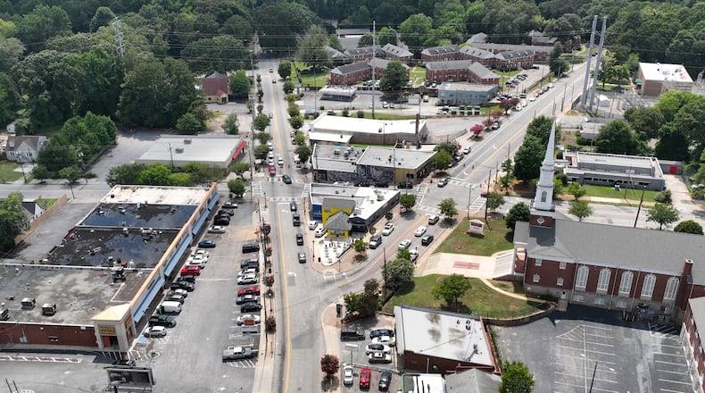 The MoreLyfe Juice Co. (center, yellow) on Cascade Road in Cascade Heights is in one of the areas in Atlanta that will benefit from a $1.7 million investment from JPMorgan Chase. The funds are designed to promote affordable commercial real estate and housing for Black small business owners, and help address the displacement of Black businesses in key neighborhoods, while providing policy recommendations for tackling affordability issues. Staff photo by Hyosub Shin / Hyosub.Shin@ajc.com