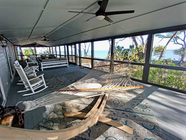 The 820-square-foot screened-in porch of the Turner House has an ocean view and is a prime gathering spot for families staying in Ted Turner's former vacation home.
(Courtesy of Blake Guthrie)