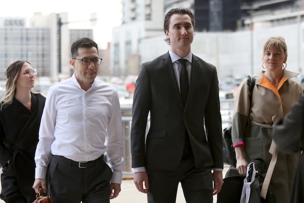 Alex Formenton, second from right, one of five members of Canada’s 2018 world junior hockey team charged with sexual assault last year for an incident that allegedly took place in June 2018, arrives at the London Courthouse in London, Ontario, Wednesday, April 23, 2025. (Nicole Osborne/The Canadian Press via AP)