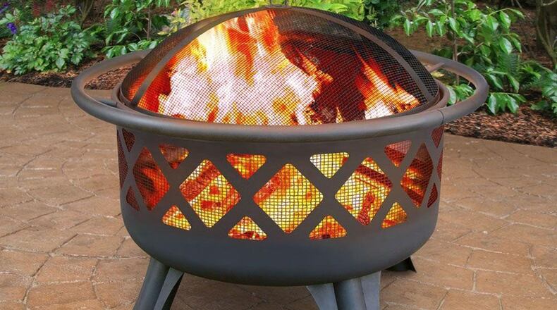 Hampton Bay’s Crossfire Fire Pit with cooking grate does double duty, $69.95, homedepot.com. (Home Depot)