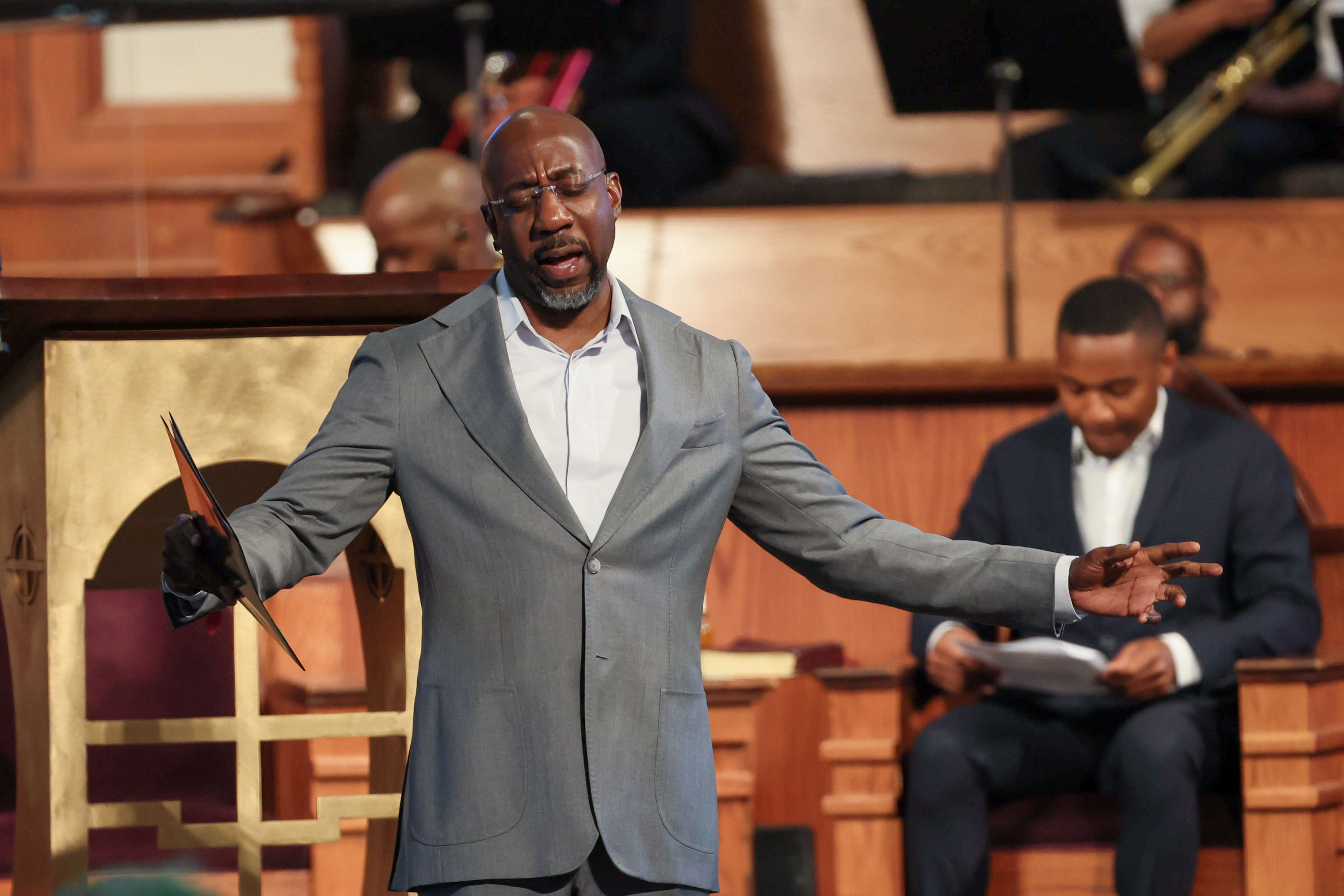 U.S. Sen. Raphael Warnock, D-Ga., leads a prayer in 2024 at Ebenezer Baptist Church in Atlanta, where he is the senior pastor. (Miguel Martinez/AJC)