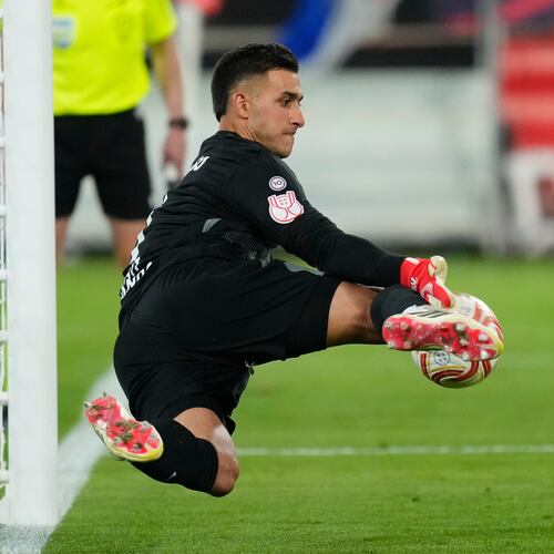 Atletico Madrid's goalkeeper Juan Musso makes a save during during the penalty shoot out at the Copa del Rey final soccer match between Atletico Madrid and Real Sociedad in Seville, Spain, Saturday, April. 18, 2026. (AP Photo/Jose Breton)