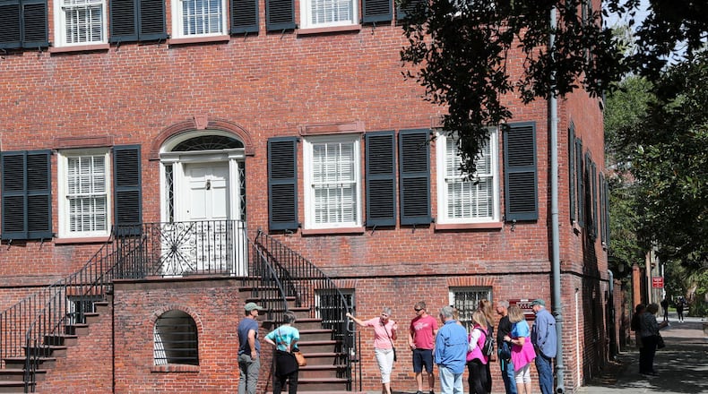 (file photo) A tour group stops outside the Davenport House Museum during a walking tour in the historic district of Savannah, Georgia. (Photo Courtesy of Richard Burkhart/Savannah Morning News)