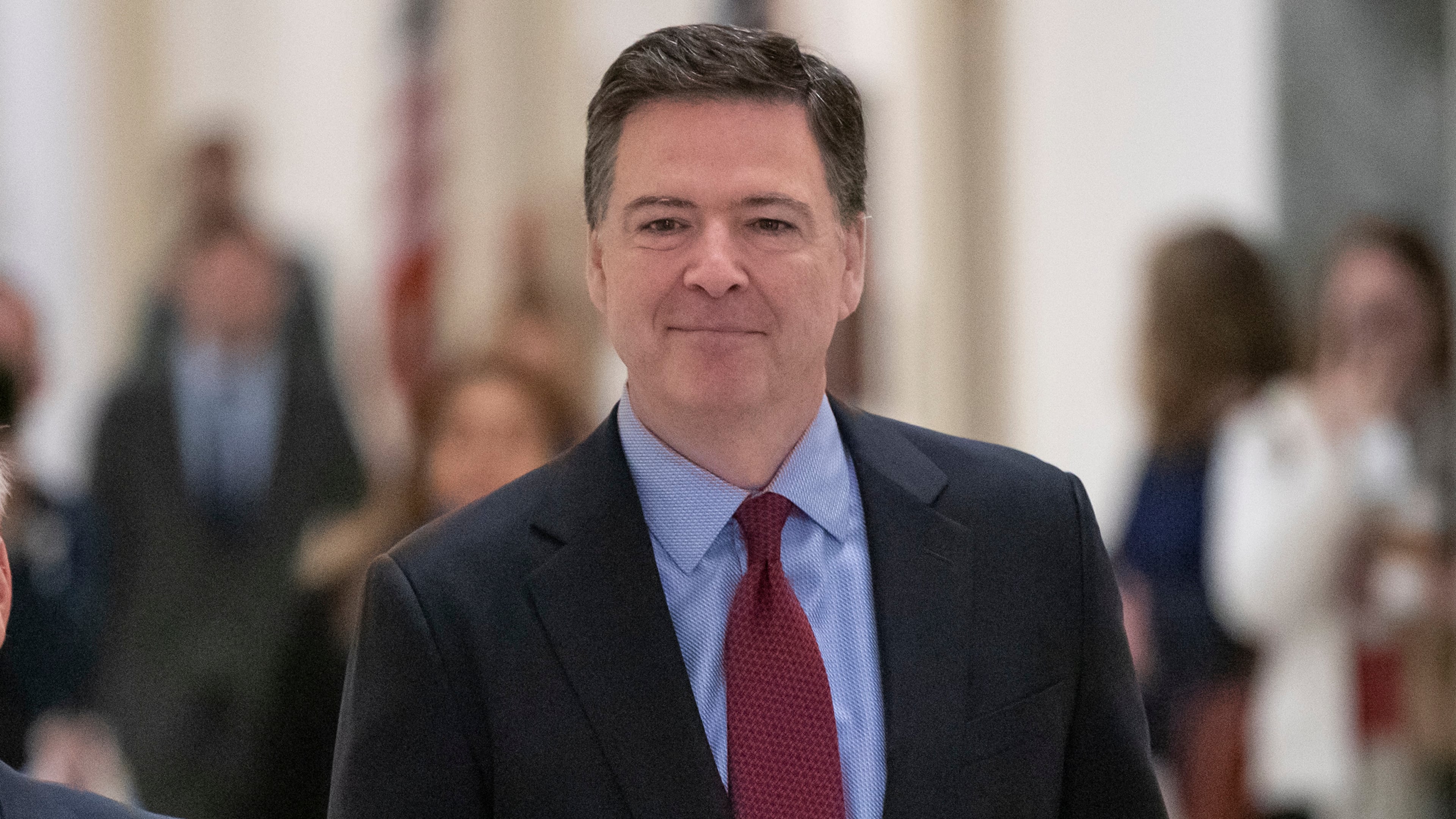 FILE - Former FBI Director James Comey, arrivex to testify under subpoena behind closed doors before the House Judiciary and Oversight Committee on Capitol Hill in Washington, Dec. 7, 2018. (AP Photo/J. Scott Applewhite, File)