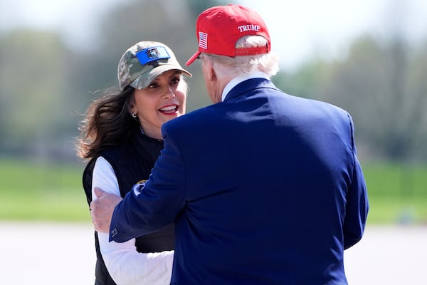 President Donald Trump greets Michigan Gov. Gretchen Whitmer as he arrives on Air Force One at Selfridge Air National Guard Base, Tuesday, April 29, 2025, in Harrison Township, Mich. (AP Photo/Alex Brandon)