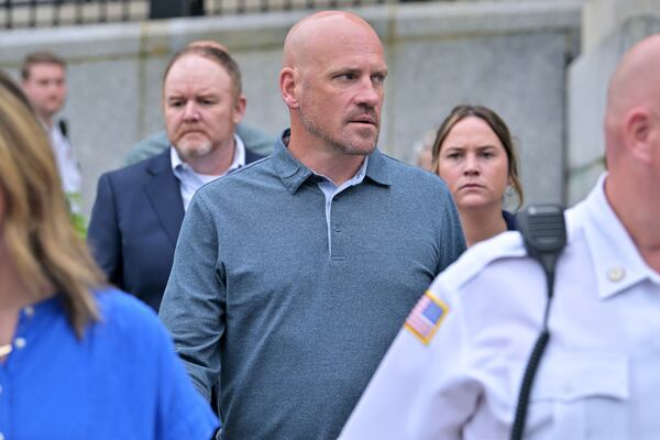 Paul O'Keefe, brother of John O'Keefe, looks toward Karen Read as they leave the courthouse at the start of the third day of jury deliberations in Read's trial at Norfolk Superior Court, Wednesday, June 18, 2025, in Dedham, Mass. (AP Photo/Josh Reynolds)