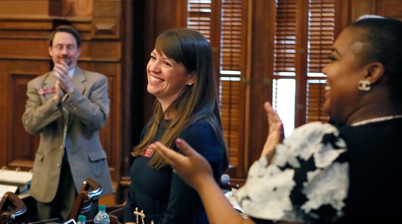Rep. Teri Anulewicz (D-Smyrna) is congratulated after her first bill passed the house, March 1, 2019. (Bob Andres/The Atlanta Journal-Constitution/TNS)