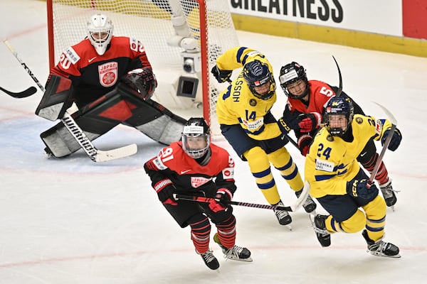 From left, goalkeeper Miyuu Masuhara of Japan, Umeka Odaira of Japan, Ida Karlsson of Sweden, Shiori Yamashita of Japan and Ebba Hedqvist of Sweden in action during the IIHF Women's World Championship, Group B, match between Japan and Sweden, in Ceske Budejovice, Czech Republic, Sunday, April 13, 2025. (Luboš Pavlíček/CTK via AP)