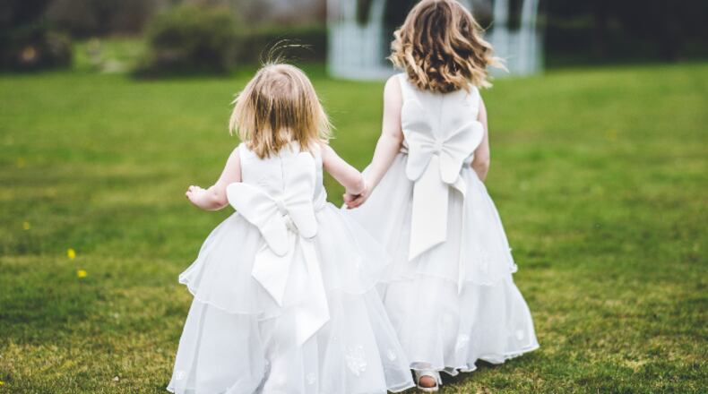 Two tiny flower girls from a wedding (stock photo).