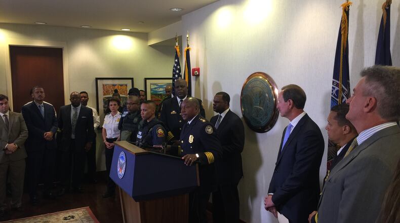 Atlanta Police Chief George Turner, Mayor Kasim Reed and others gather Thursday for announcement of Georgia Power Foundation’s $900,000 donation to city for police body armor.