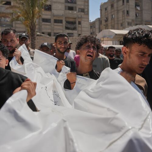 Mourners carry the body of Palestinian Abdullah Moussa, 30, who was killed in an Israeli airstrike, during his funeral in Khan Younis, southern Gaza Strip, Saturday, June 27, 2026. (AP Photo/Abdel Kareem Hana)