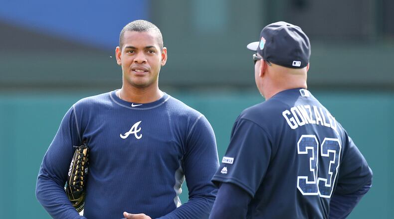 022216 LAKE BUENA VISTA: Braves left fielder Hector Olivera confers with manager Fredi Gonzalez during spring training in Champion Stadium on Monday, Feb 22, 2016, at the ESPN Wide World of Sports, Lake Buena Vista, FL. Curtis Compton / ccompton@ajc.com