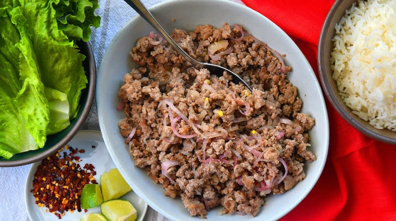 Laab-Style Pork has the critical tang of lime juice, funk of fish sauce and nuttiness of toasted rice powder. (Chris Hunt for The Atlanta Journal-Constitution)