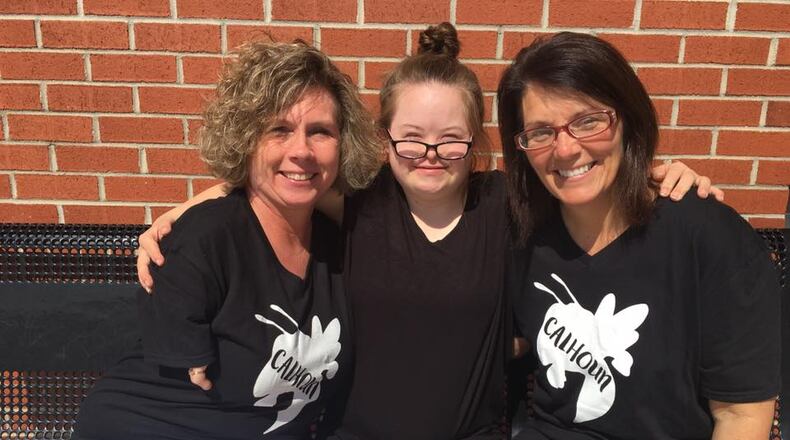 Tonya Reeves Turner (left), a retired teacher and coach, will provide supervision and support for Grace Key, a junior cheerleader at Calhoun High School. The squad is coached by Ginger Reeves (right). (Photo: Calhoun City Schools)