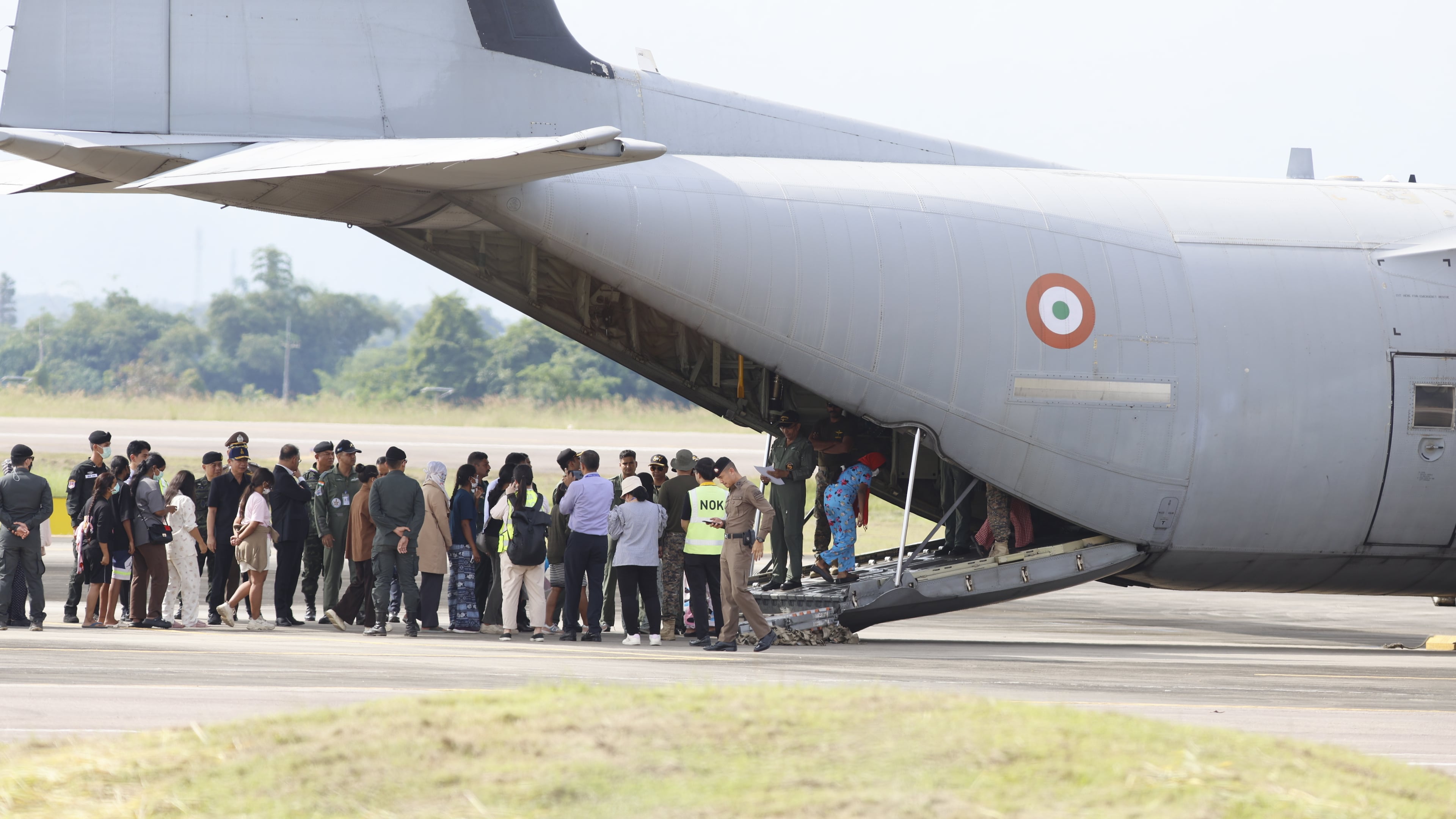 India nationals, believed to have worked at scam center in Myanmar, board a plane at Thailand's Mae Sot International Airport in Tak, before being sent back to India, Thursday, Nov. 6, 2025. (AP Photo/Sarot Meksophawannakul)