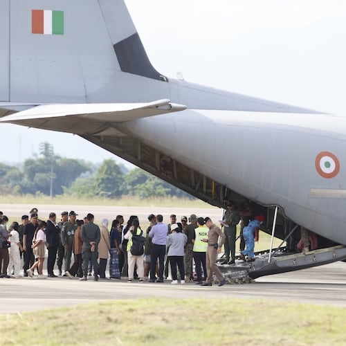 India nationals, believed to have worked at scam center in Myanmar, board a plane at Thailand's Mae Sot International Airport in Tak, before being sent back to India, Thursday, Nov. 6, 2025. (AP Photo/Sarot Meksophawannakul)