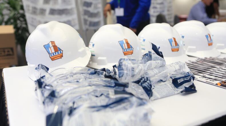 Hard hats for distribution during the Construction Education Foundation of Georgia (CEFGA) career expo on Thursday, March 12, 2020, at the World Congress Center in Atlanta. This year, additional safety measures were implemented, including mandatory hard hats and wipe downs of surfaces. CHRISTINA MATACOTTA, FOR THE ATLANTA JOURNAL-CONSTITUTION