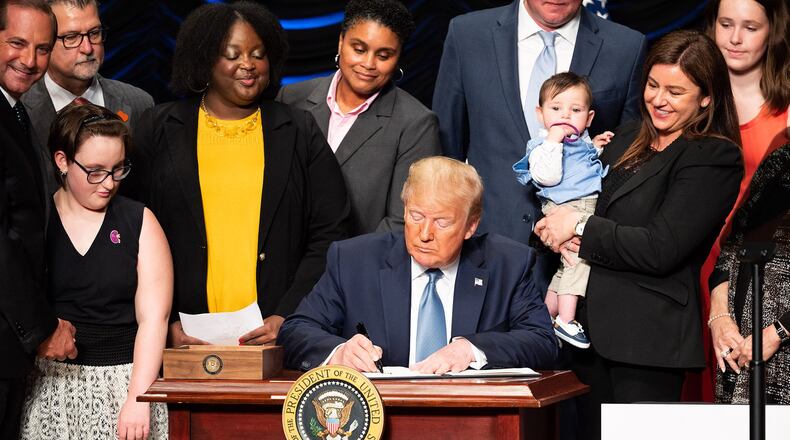 President Donald Trump signs an executive order Wednesday to advance kidney health at the Ronald Reagan Building and International Trade Center in Washington. (PHOTO by Michael Brochstein/Sipa USA/TNS)