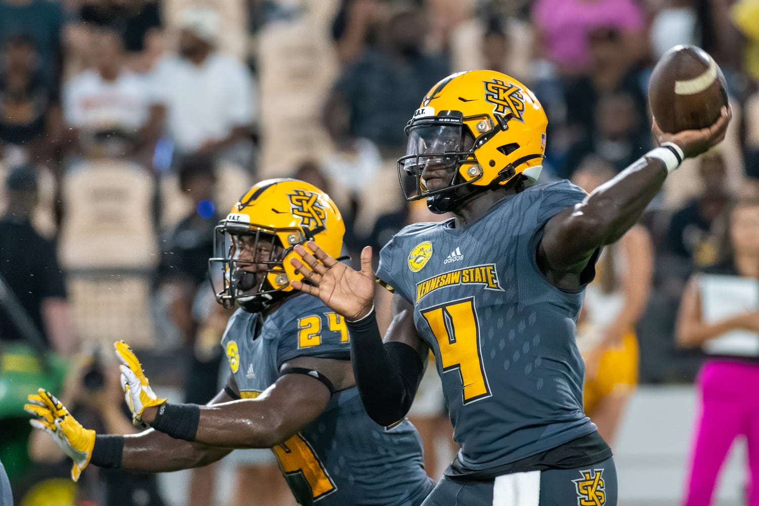 KSU's quarterback Jonathan Murphy throws a pass against Tusculum Thursday night in Marietta. Kennesaw State won 38-7.  (Jamie Spaar for the Atlanta Journal Constitution)
