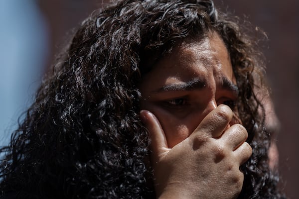 An immigrant woman whose partner was detained in immigration court cries during a press conference on Tuesday, July 8, 2025, in New York. (AP Photo/Olga Fedorova)