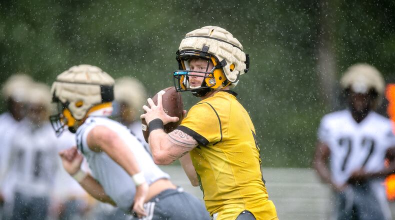 Kennesaw State quarterback Chandler Burks looks for an open receiver in one of the Owls' first camp practices ahead of the 2018 football season.
