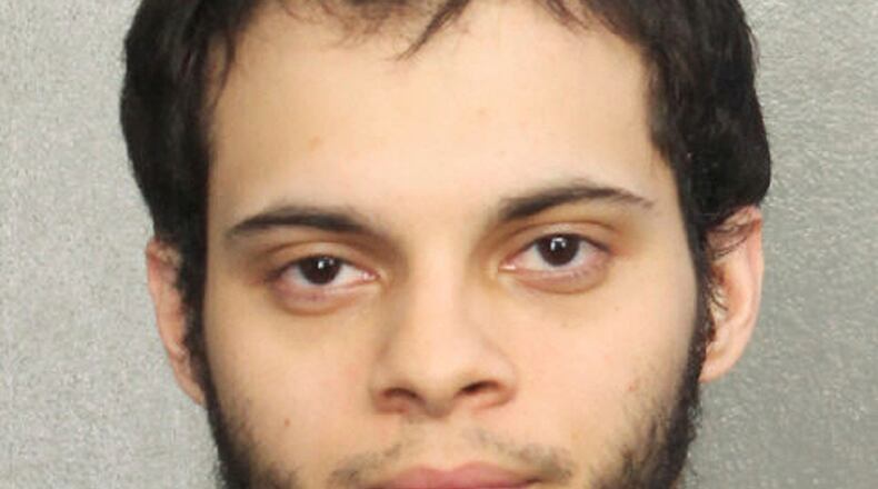 This booking photo provided by the Broward Sheriff's Office shows suspect Esteban Ruiz Santiago, 26, Saturday, Jan. 7, 2017, in Fort Lauderdale, Fla. Relatives of the man who police say opened fire Friday killing several people and wounding others at a Florida airport report he had a history of mental health issues. They tell The Associated Press and other news outlets that some of the problems followed his time serving a military tour in Iraq, and that he was being treated at his current home in Alaska. (Broward Sheriff's Office via AP)
