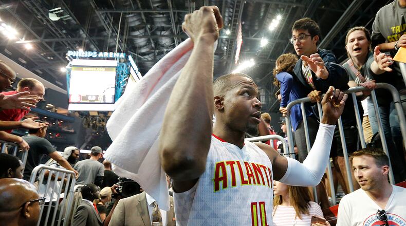 Paul Millsap celebrates a 116-98 victory over the Wizards with fans in Game 3 of a first-round NBA basketball playoff series on Saturday, April 22, 2017, in Atlanta. Curtis Compton/ccompton@ajc.com