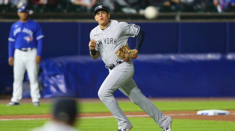 FILE - New York Yankees third baseman Gio Urshela watches his throw to first for the out on Toronto Blue Jays' Bo Bichette during the eighth inning of a baseball game June 16, 2021, in Buffalo, N.Y. (AP Photo/Jeffrey T. Barnes, File)